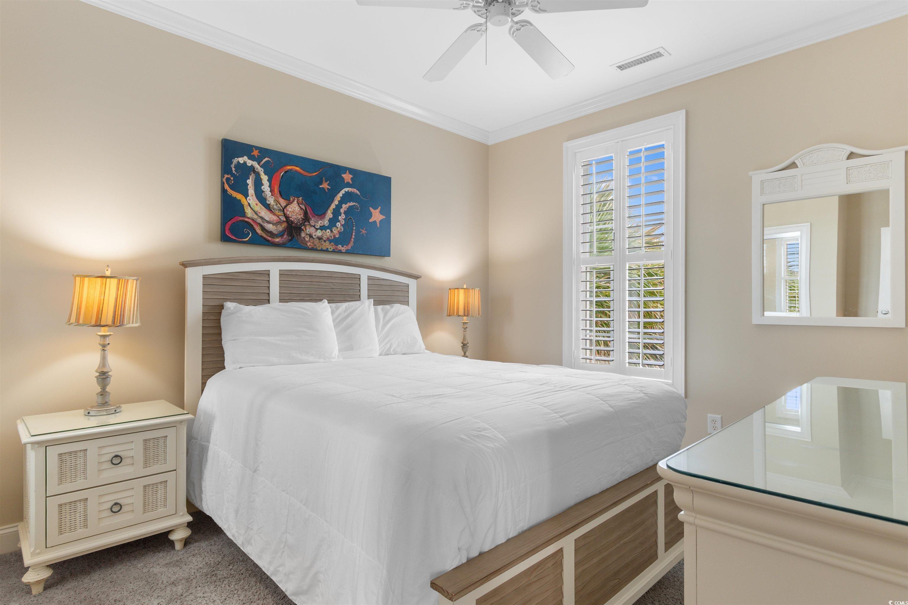 703 South Waccamaw Drive Murrells Inlet, SC 29576 - Photo 36 of 40 Bedroom with crown molding and a ceiling fan