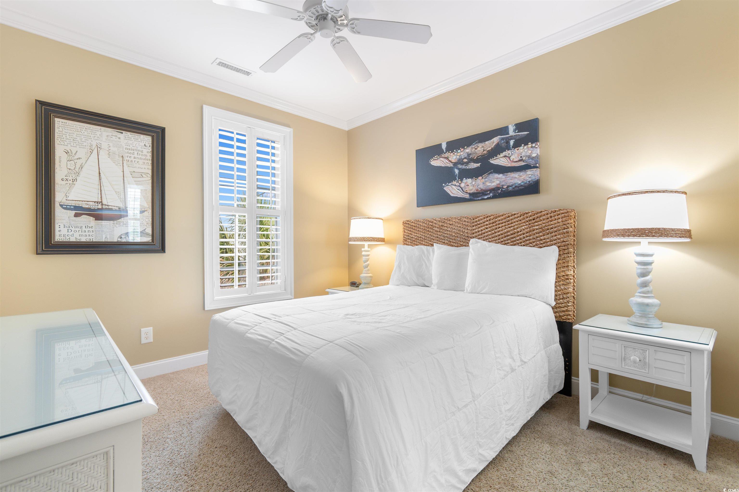 703 South Waccamaw Drive Murrells Inlet, SC 29576 - Photo 37 of 40 Bedroom featuring crown molding, and ceiling fan