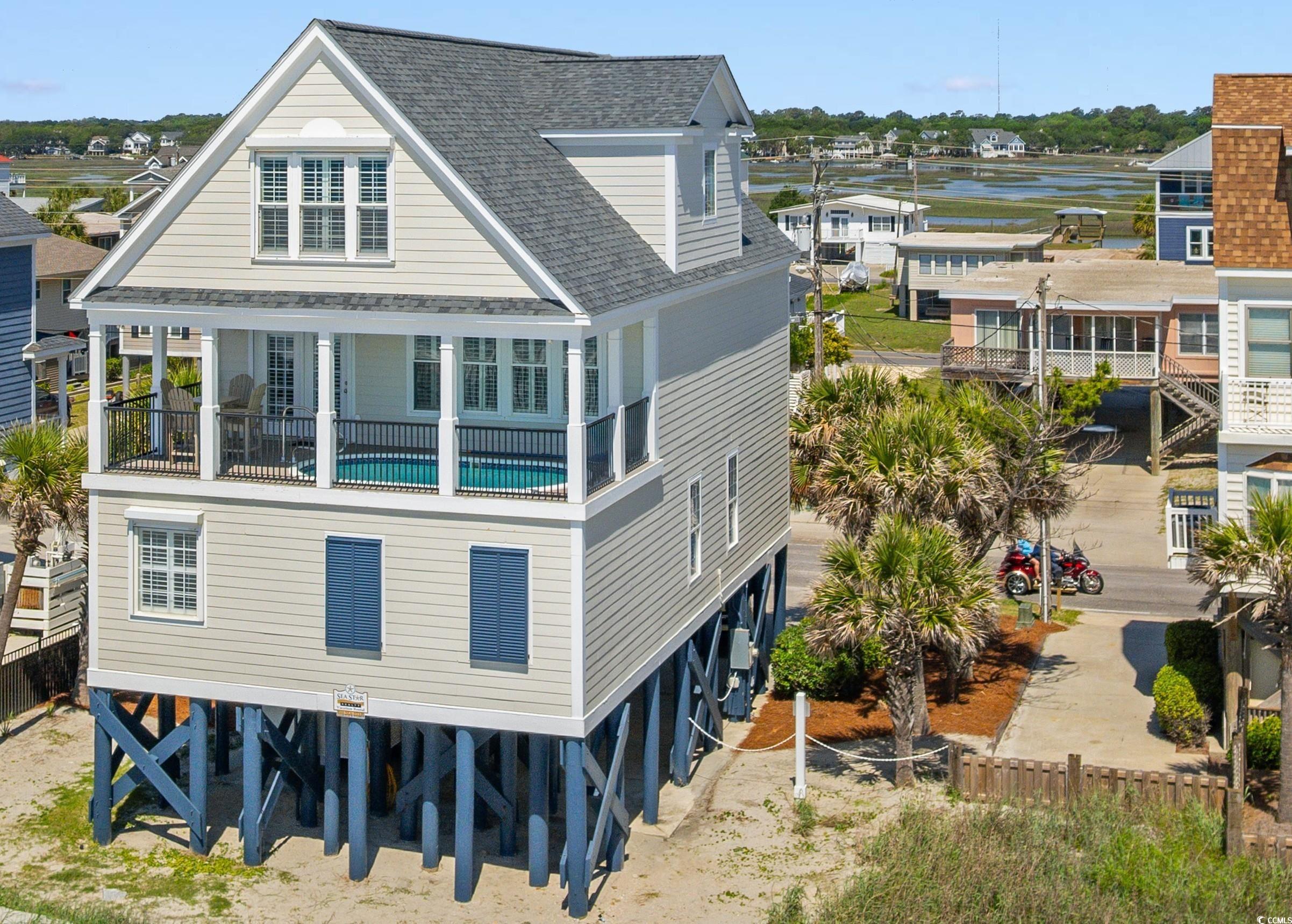 703 South Waccamaw Drive Murrells Inlet, SC 29576 - Photo 5 of 40 Rear view of house
