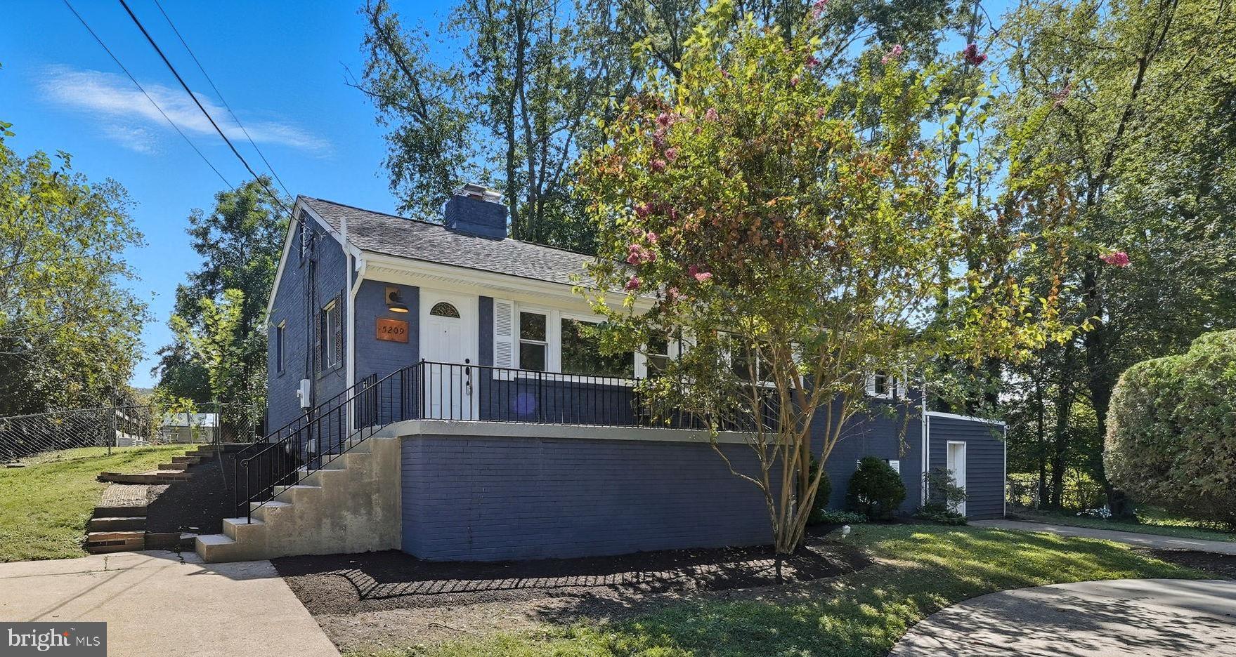a view of house with a yard