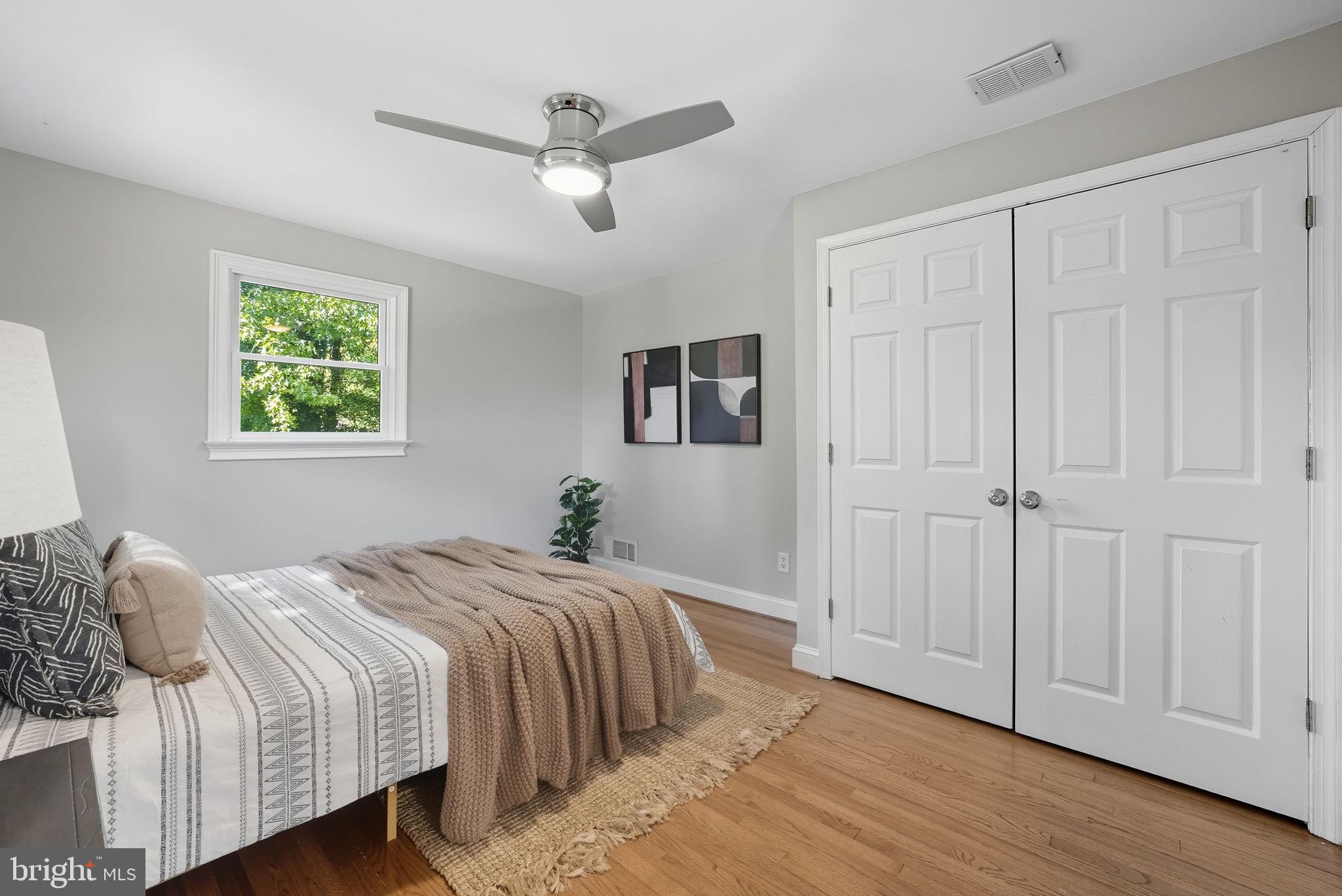 5209 Cedar Road Alexandria, VA 22309 - Photo 21 of 42 a bedroom with a large bed and a window