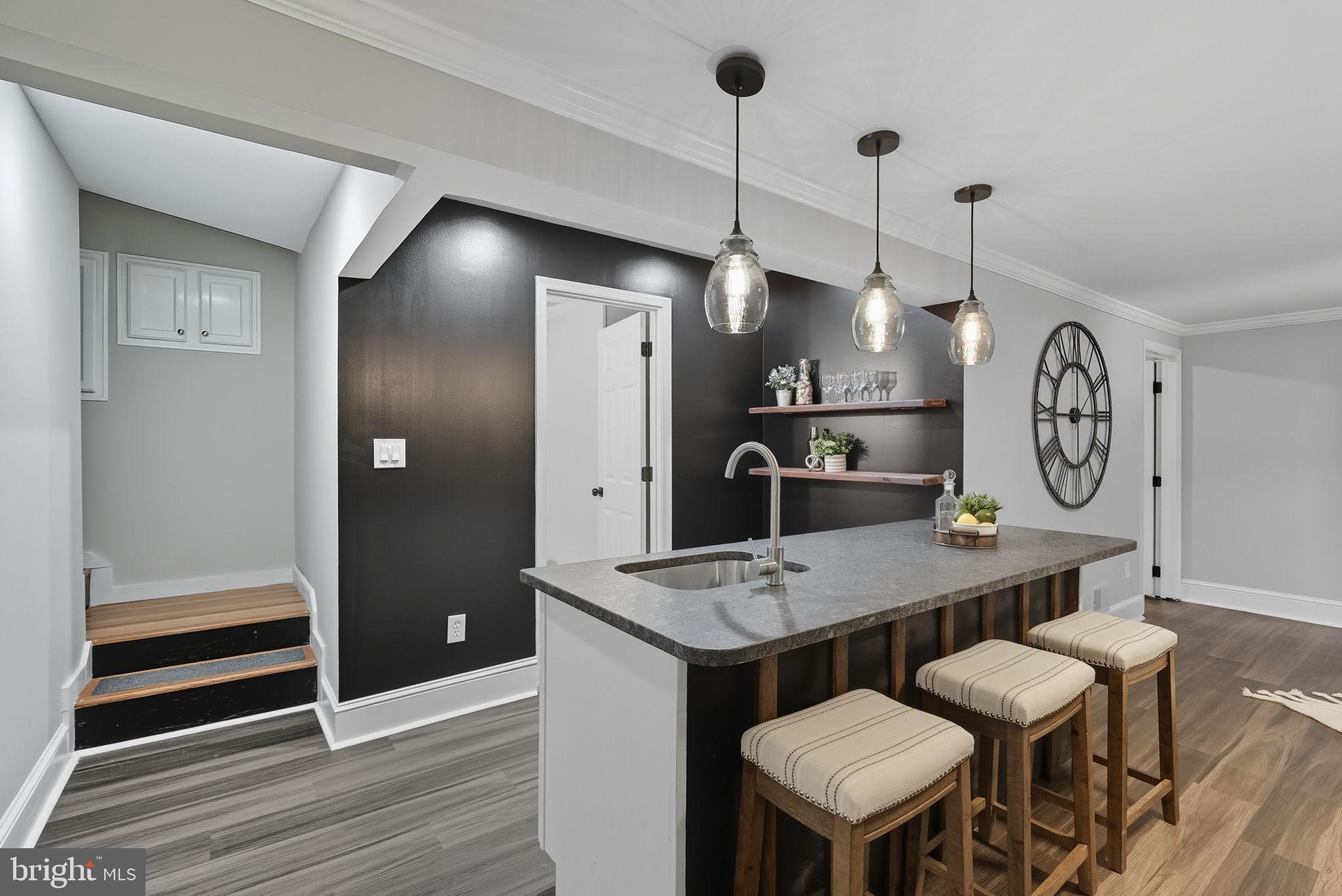 5209 Cedar Road Alexandria, VA 22309 - Photo 24 of 42 a kitchen with a table and chairs in it