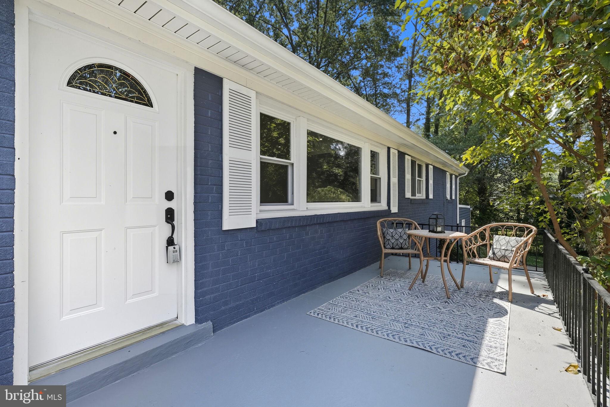5209 Cedar Road Alexandria, VA 22309 - Photo 4 of 42 a view of a house with backyard and sitting area