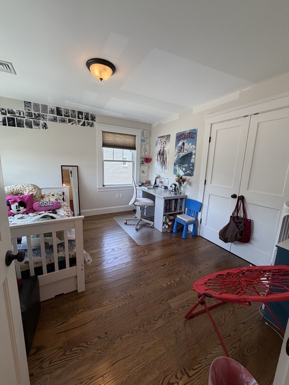 17 Cardinal Street, Unit 17 Winchester, MA 01890 - Photo 23 of 42 a living room with furniture and wooden floor