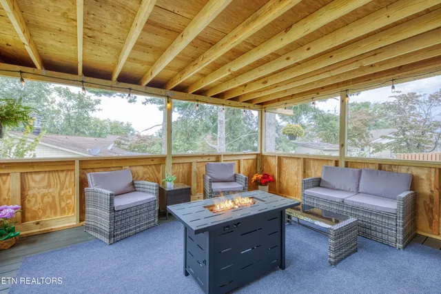 a outdoor room with patio furniture