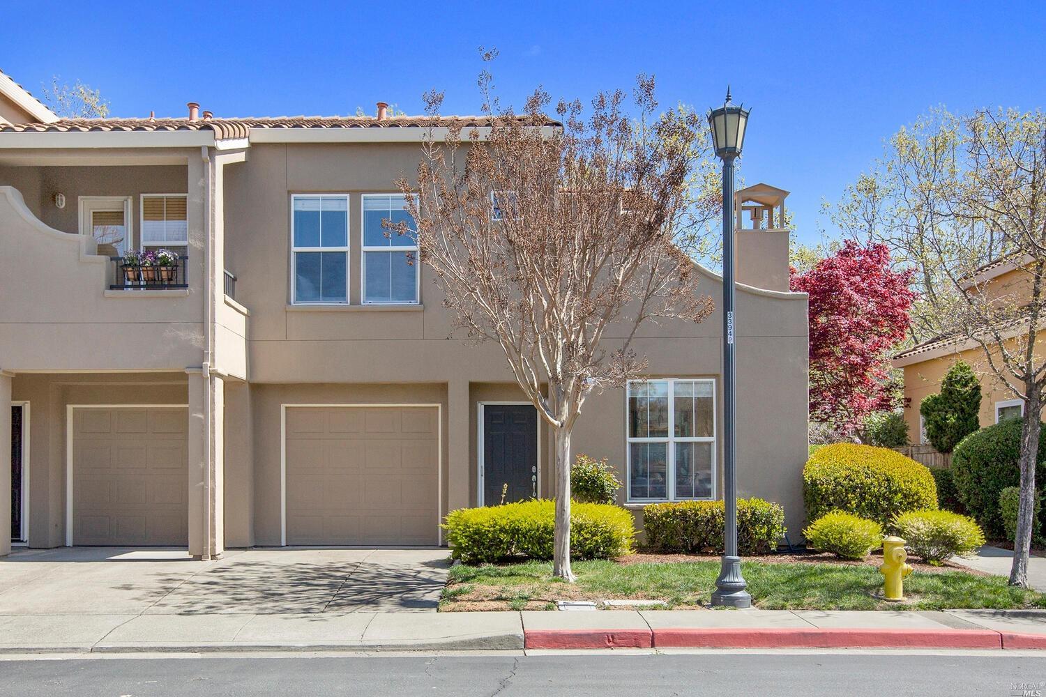 70 Gann Way Novato, CA 94949 - Photo 1 of 27 a front view of a house with garden and plants