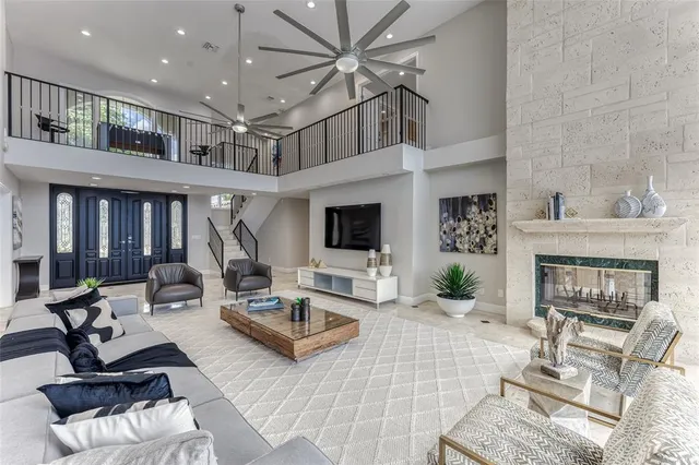 a dining room with furniture a large window and table