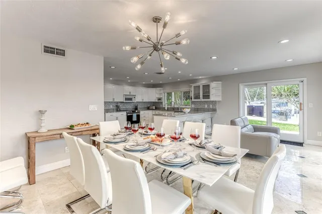 a bedroom with a large bed and a large window