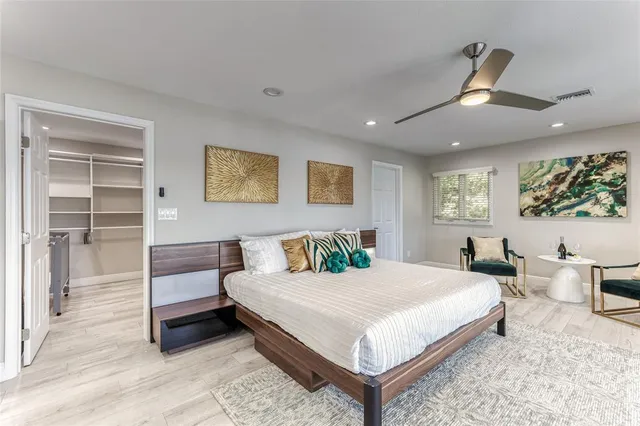 a bathroom with a double vanity sink mirror and shower