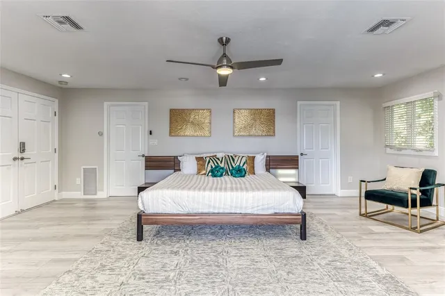 a bedroom with two beds and a couch