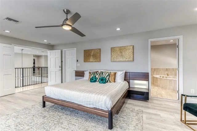 a living room with furniture a flat screen tv and a large window