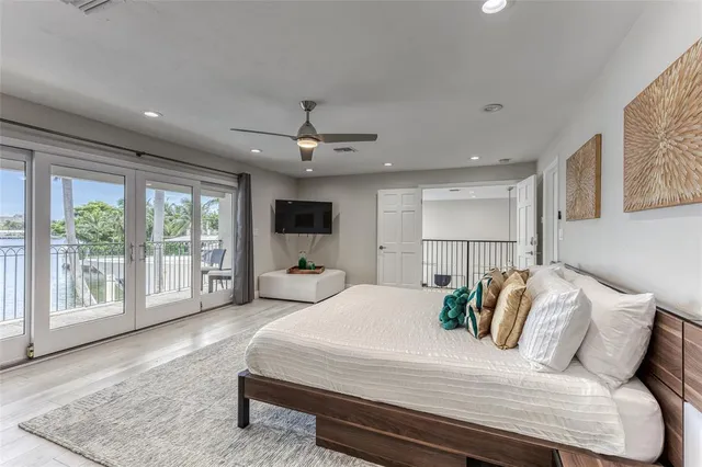 a bedroom with bed and window