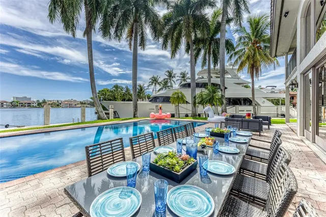 a view of swimming pool with outdoor seating