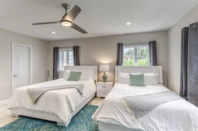 a bathroom with a sink mirror vanity and toilet