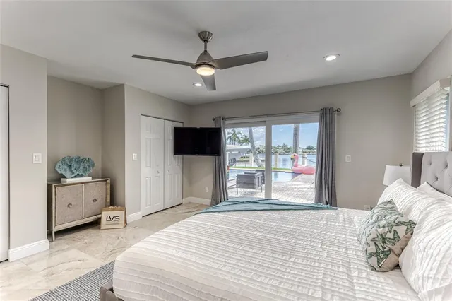 a view of a swimming pool with outdoor seating