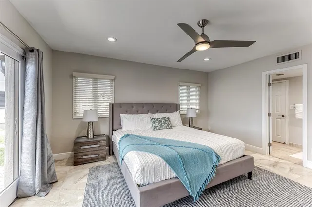 a view of swimming pool with outdoor seating and a patio