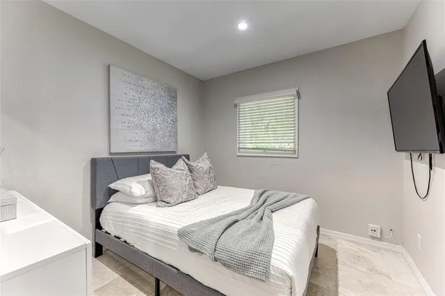 a view of a patio with furniture table and chairs