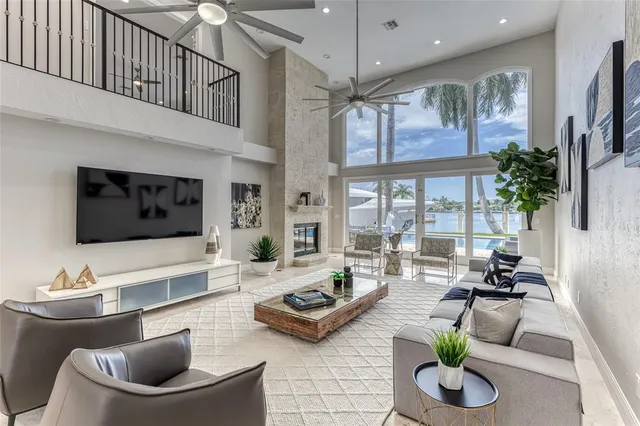 a bedroom with a large bed and a large window