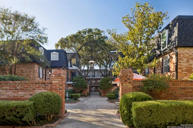 a view of a house with a tree