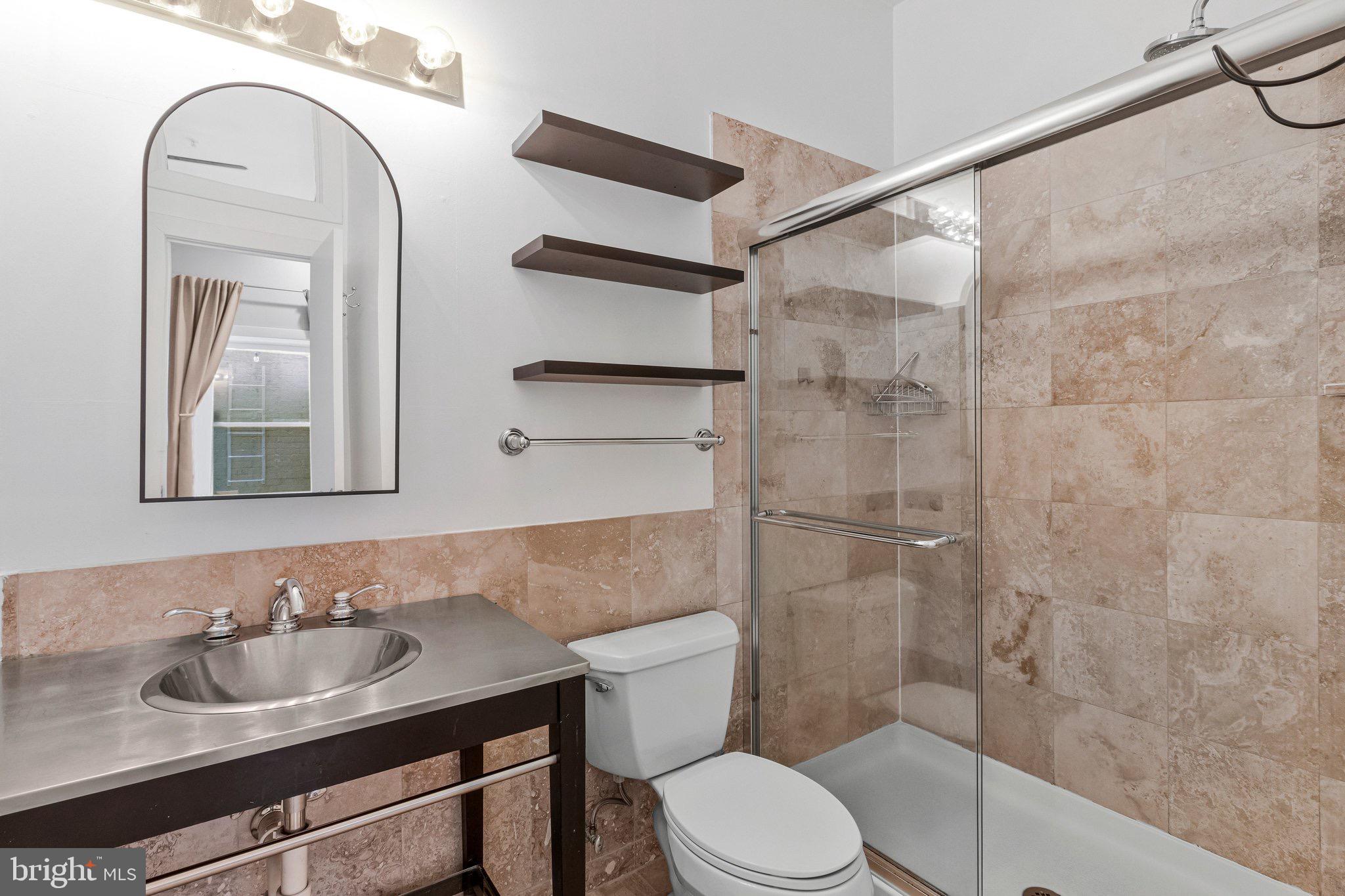 1240 4th Street Northwest, Unit T Washington, DC 20001 - Photo 24 of 28 Modern bathroom with elegant finishes.