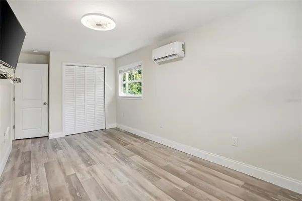 a view of room with window and hardwood floor