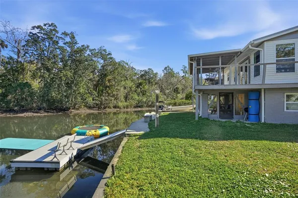 a view of a lake with a house in the background