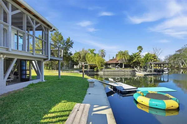 a view of a swimming pool with a patio