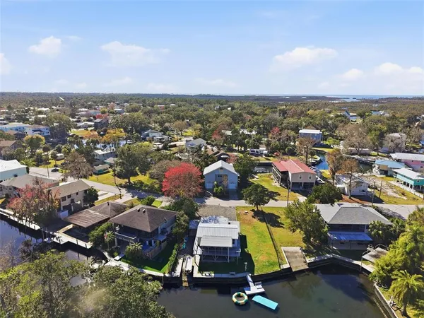 an aerial view of residential houses with outdoor space
