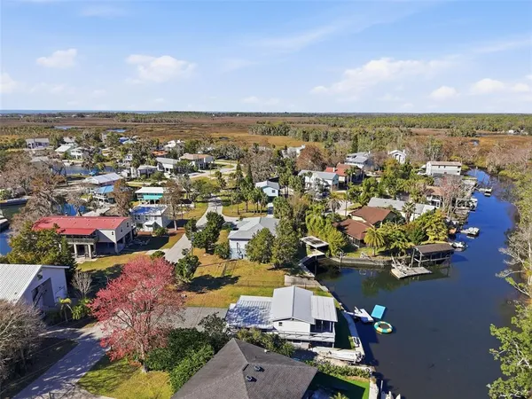 an aerial view of residential houses with outdoor space