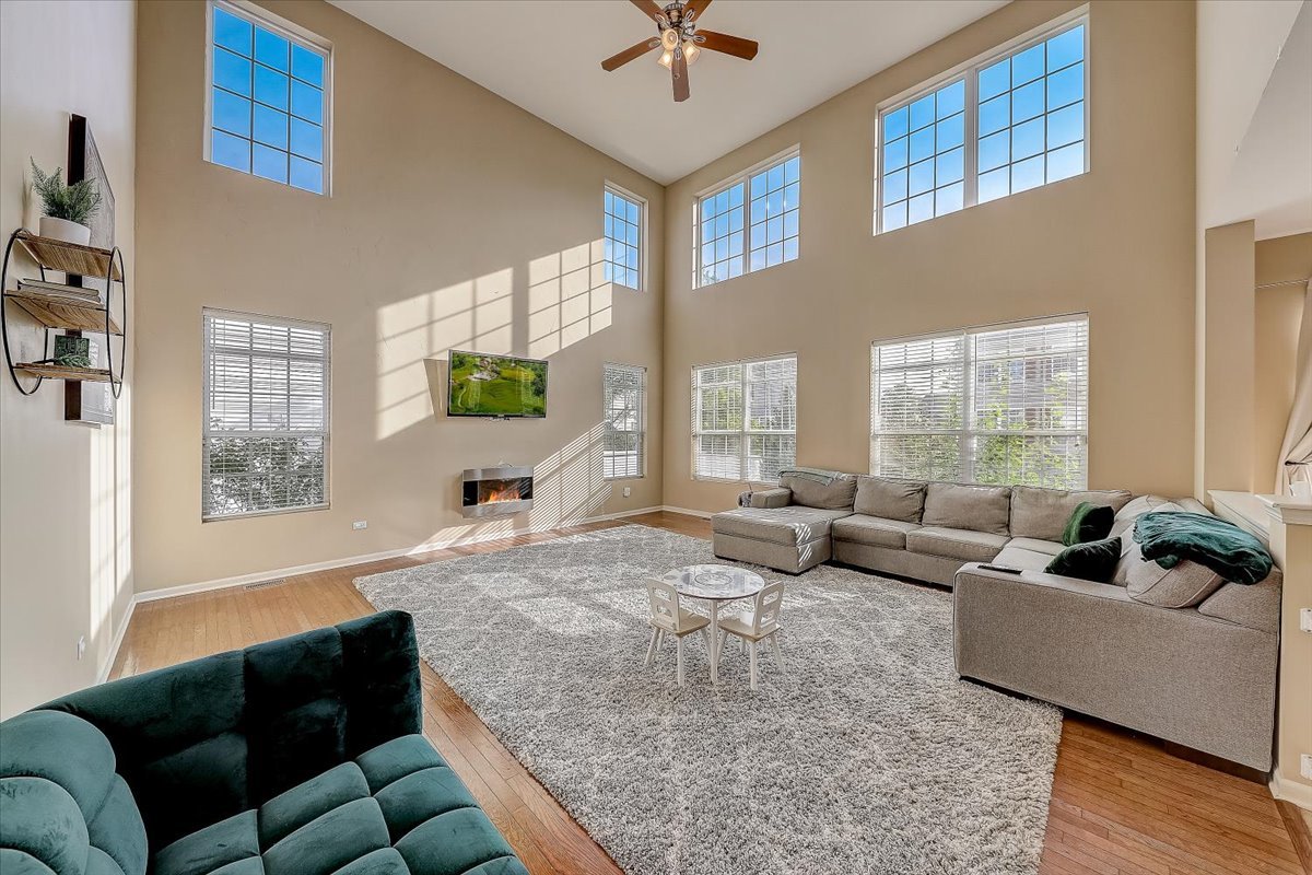 406 Aviary Lane Bolingbrook, IL 60490 - Photo 18 of 46 a living room with furniture and a large window