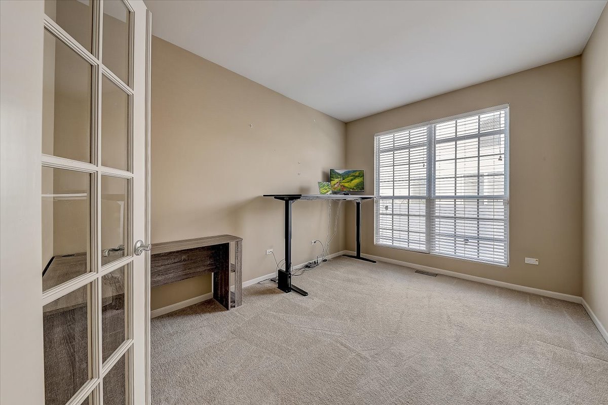 406 Aviary Lane Bolingbrook, IL 60490 - Photo 20 of 46 a view of an empty room with a window