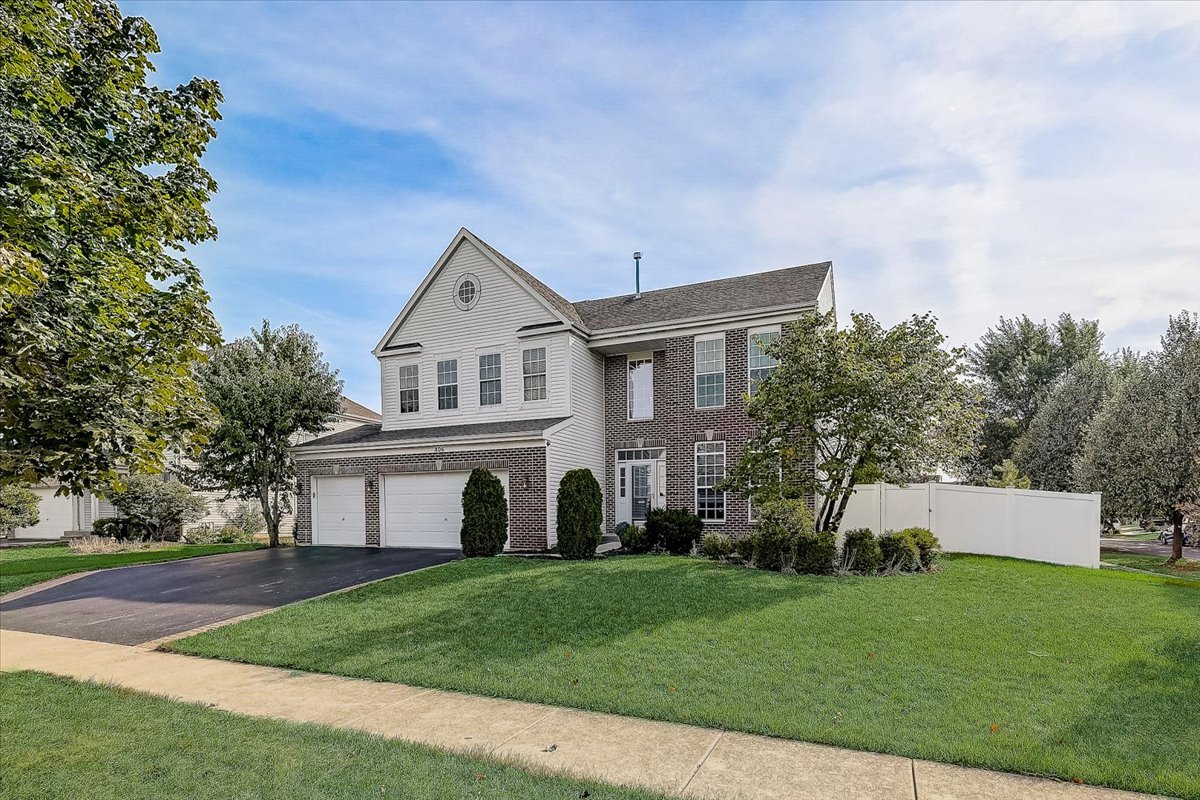 406 Aviary Lane Bolingbrook, IL 60490 - Photo 3 of 46 front view of house with a yard