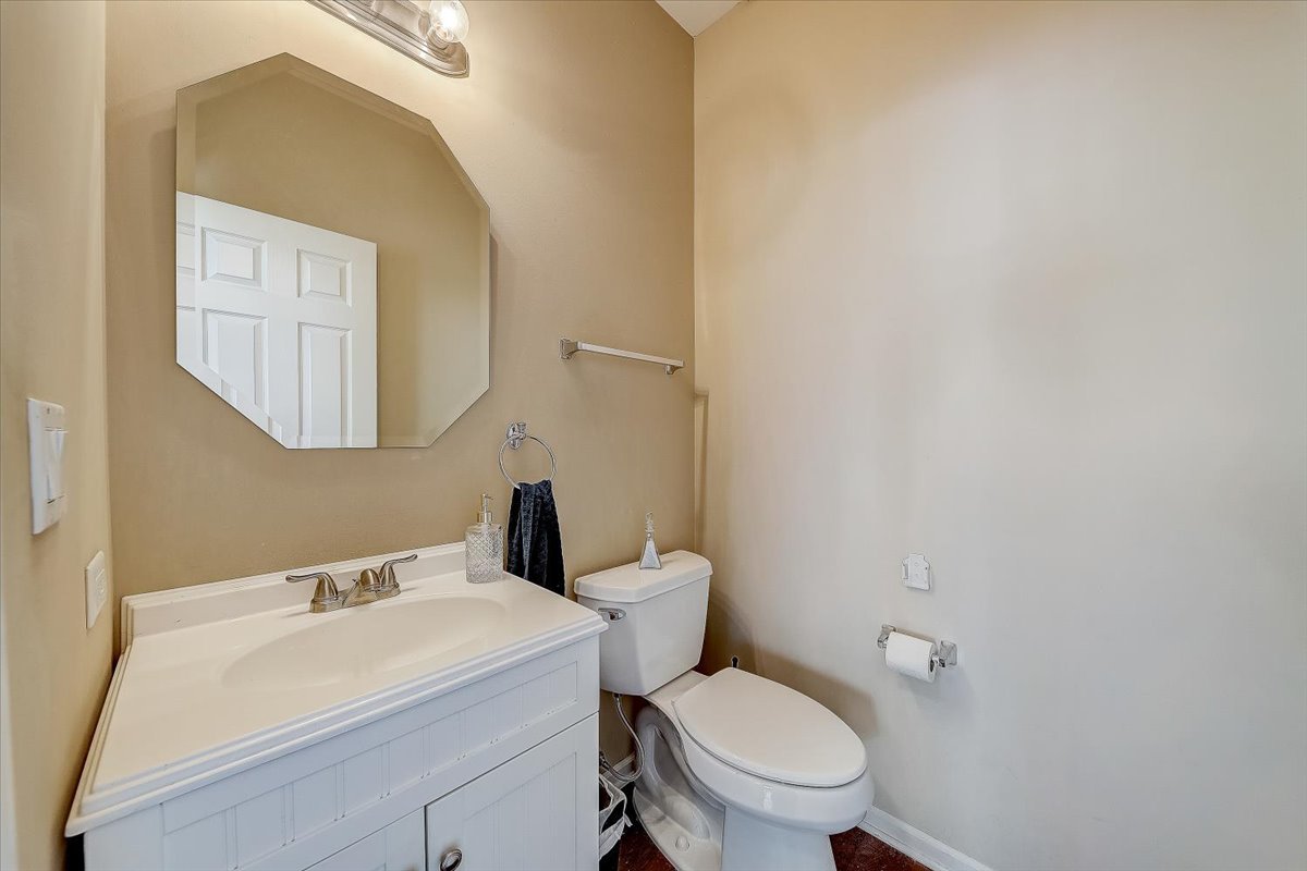 406 Aviary Lane Bolingbrook, IL 60490 - Photo 22 of 46 a bathroom with a sink a toilet and mirror