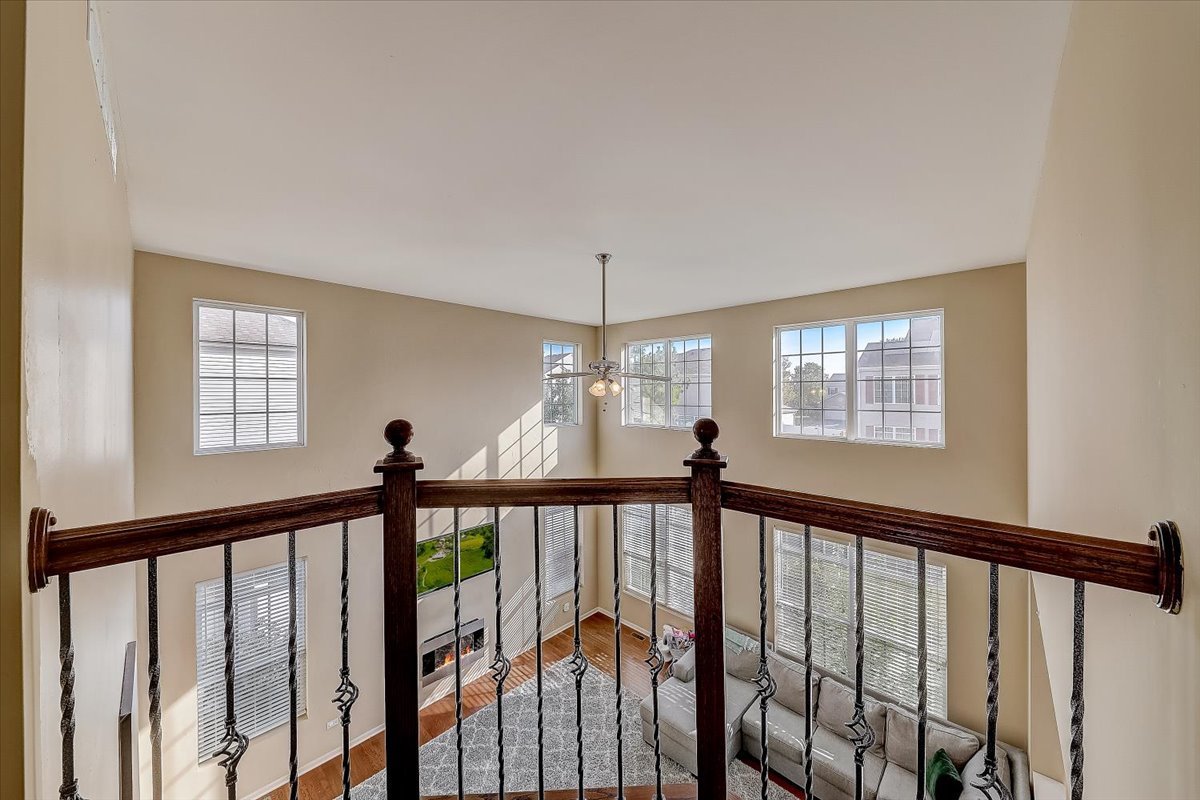 406 Aviary Lane Bolingbrook, IL 60490 - Photo 24 of 46 a view of a hallway with window and stairs