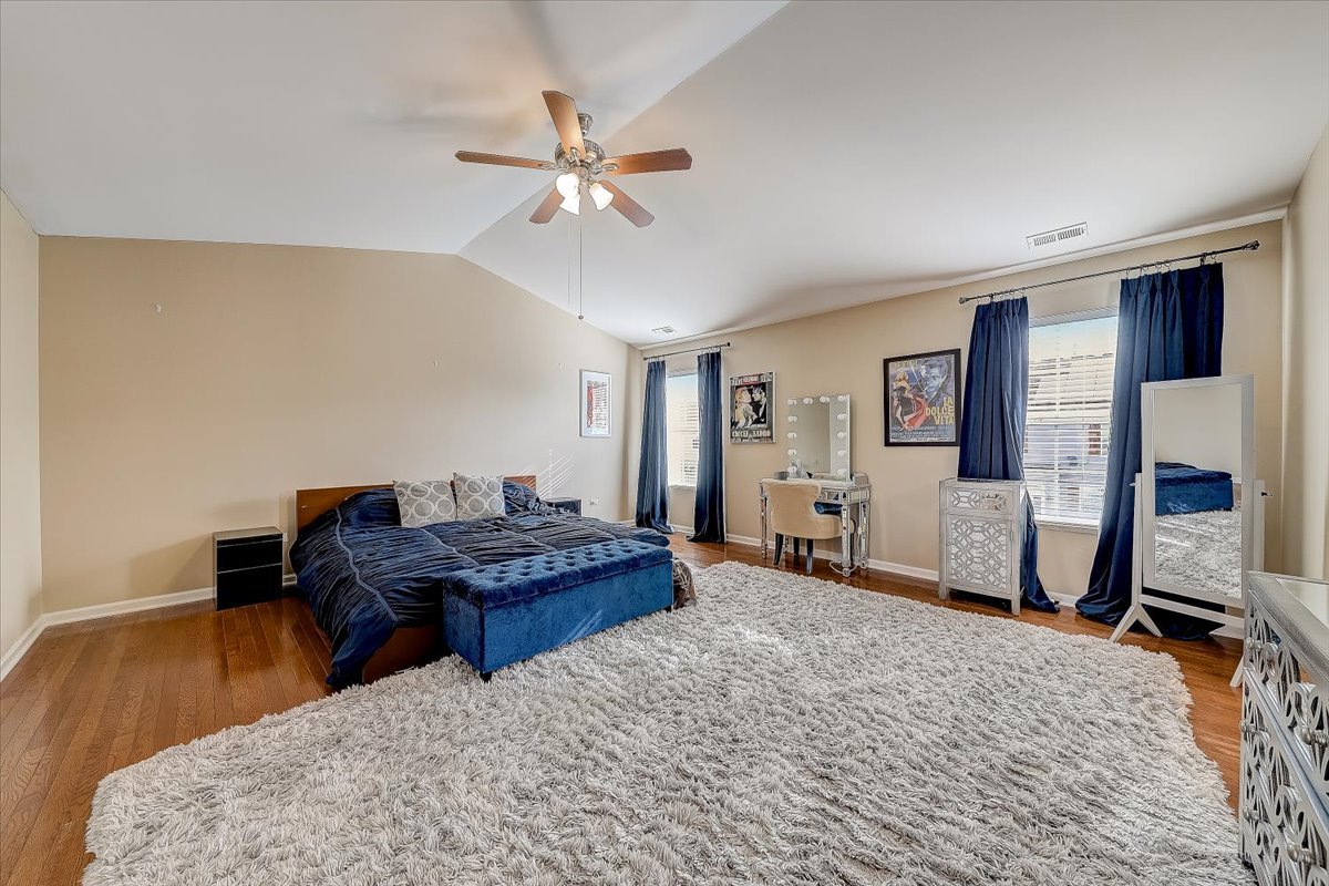 406 Aviary Lane Bolingbrook, IL 60490 - Photo 27 of 46 a living room with furniture and wooden floor