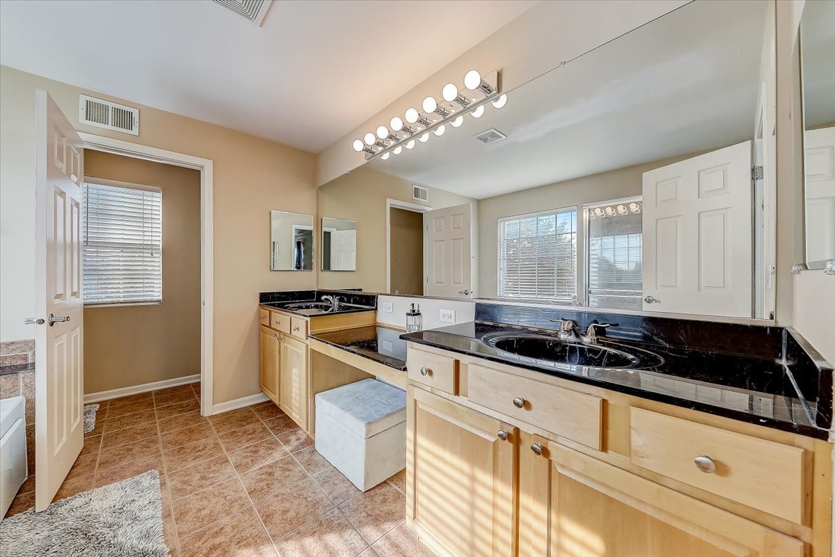 406 Aviary Lane Bolingbrook, IL 60490 - Photo 29 of 46 a kitchen with a sink and cabinets