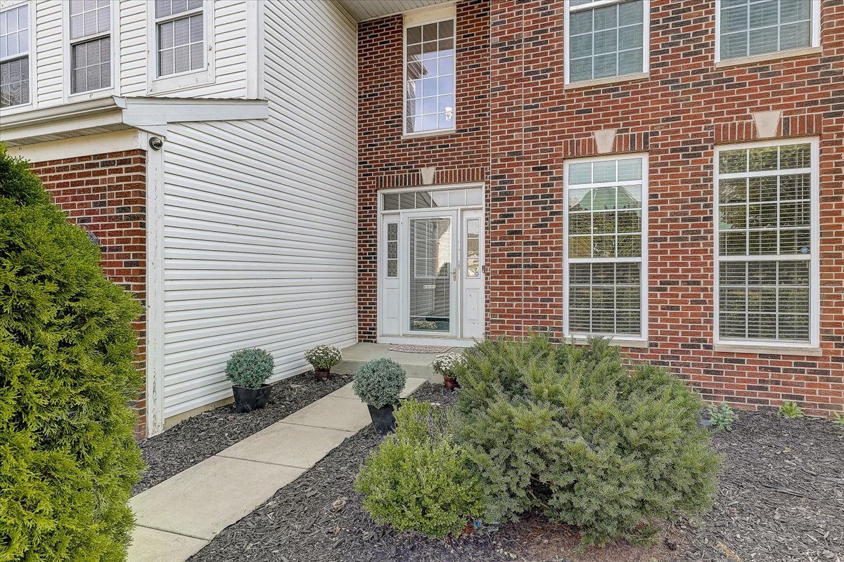 406 Aviary Lane Bolingbrook, IL 60490 - Photo 4 of 46 a house view with a backyard