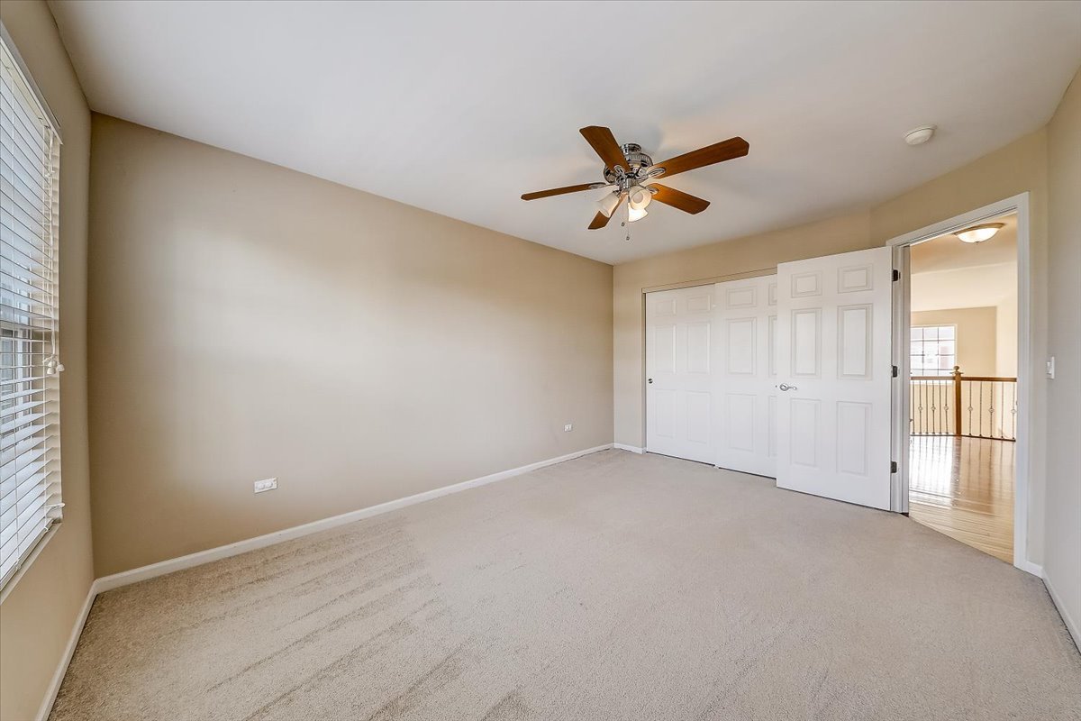 406 Aviary Lane Bolingbrook, IL 60490 - Photo 35 of 46 wooden floor in an empty room with a window