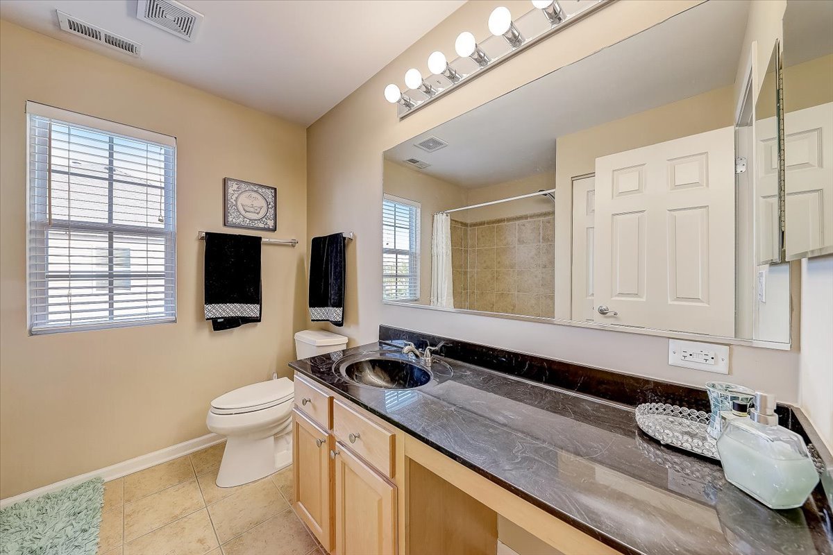 406 Aviary Lane Bolingbrook, IL 60490 - Photo 38 of 46 a bathroom with a granite countertop sink and a mirror
