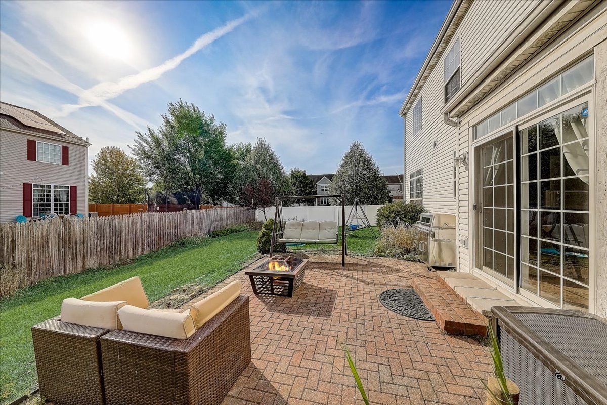 406 Aviary Lane Bolingbrook, IL 60490 - Photo 40 of 46 a view of a patio with couches chairs and wooden fence