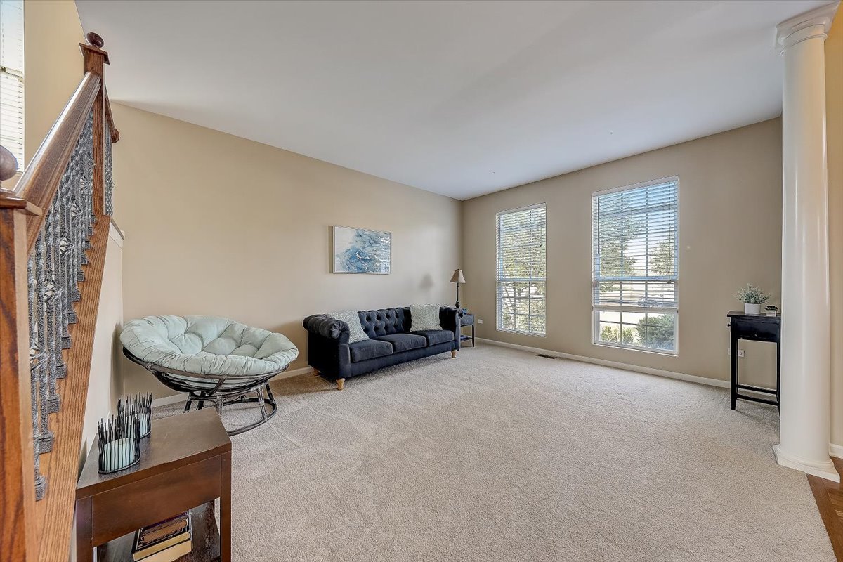 406 Aviary Lane Bolingbrook, IL 60490 - Photo 7 of 46 a living room with furniture and a window