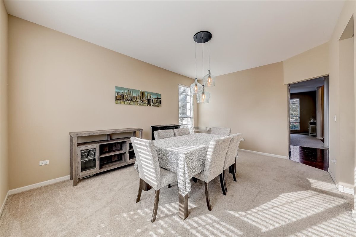 406 Aviary Lane Bolingbrook, IL 60490 - Photo 10 of 46 a view of a dining room with furniture