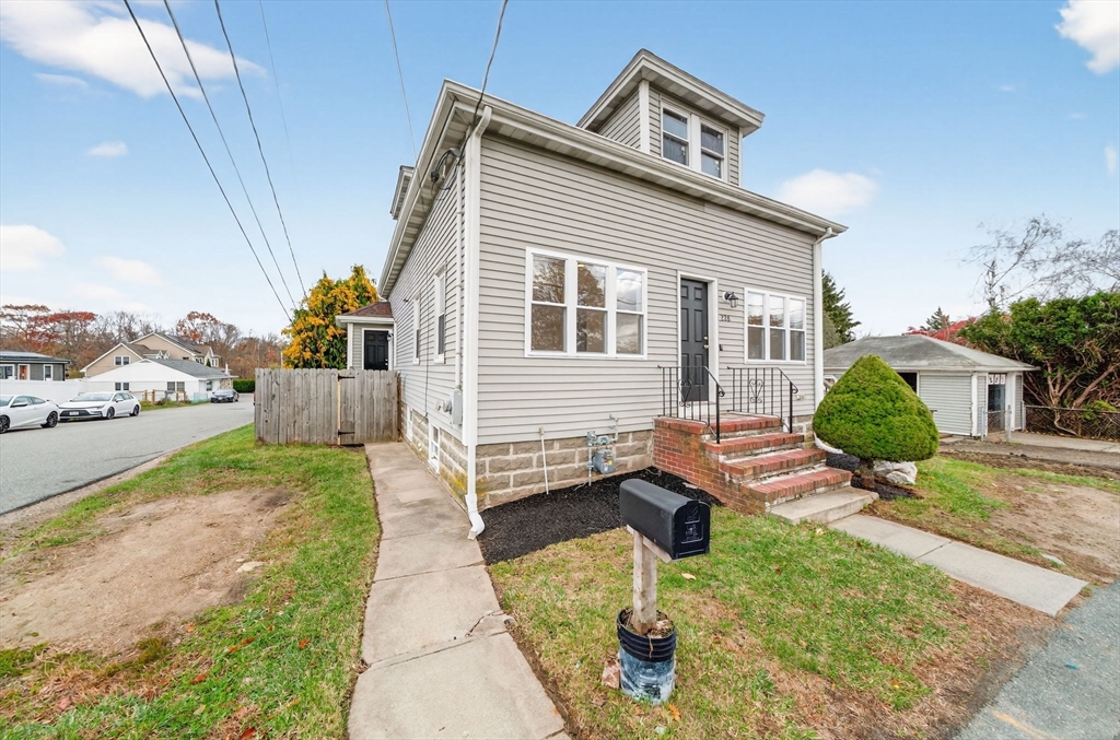 228 Dickinson Street Fall River, MA 02721 - Photo 1 of 40 a view of a house with backyard and sitting area