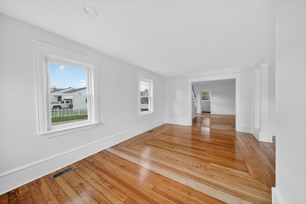 228 Dickinson Street Fall River, MA 02721 - Photo 12 of 40 a view of a room with wooden floor and window