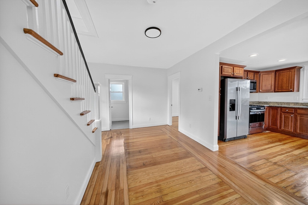 228 Dickinson Street Fall River, MA 02721 - Photo 13 of 40 a view of a kitchen with furniture and wooden floor