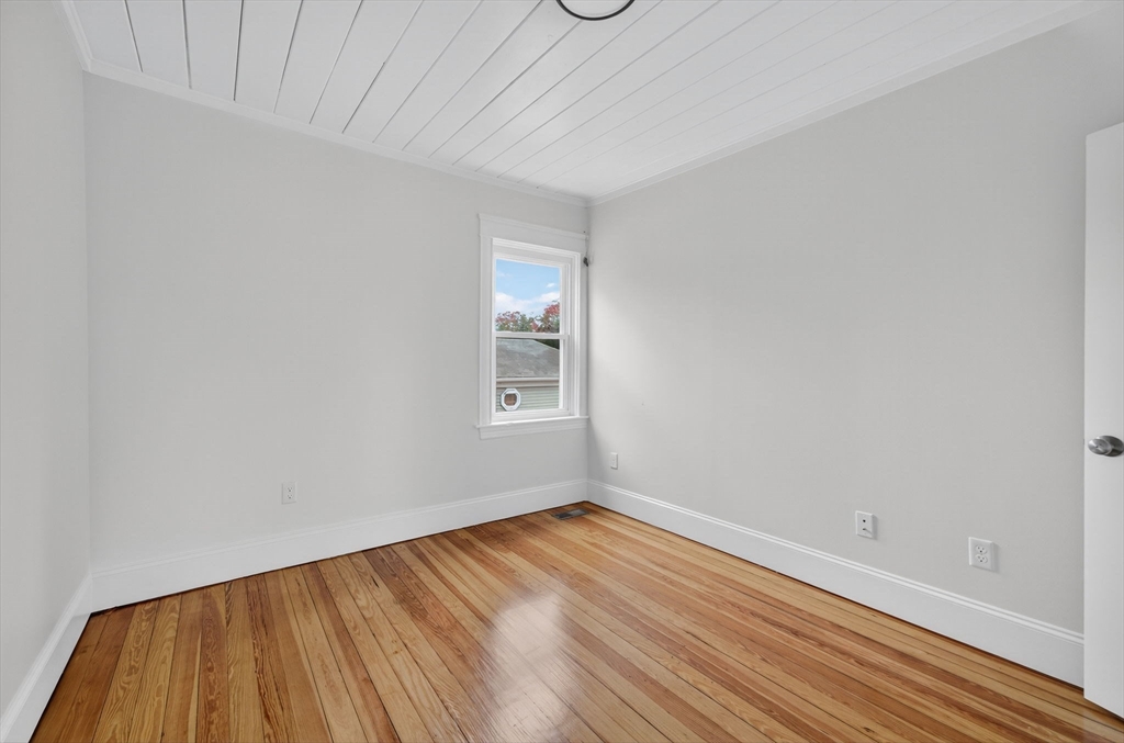 228 Dickinson Street Fall River, MA 02721 - Photo 15 of 40 a view of a room with wooden floor and window