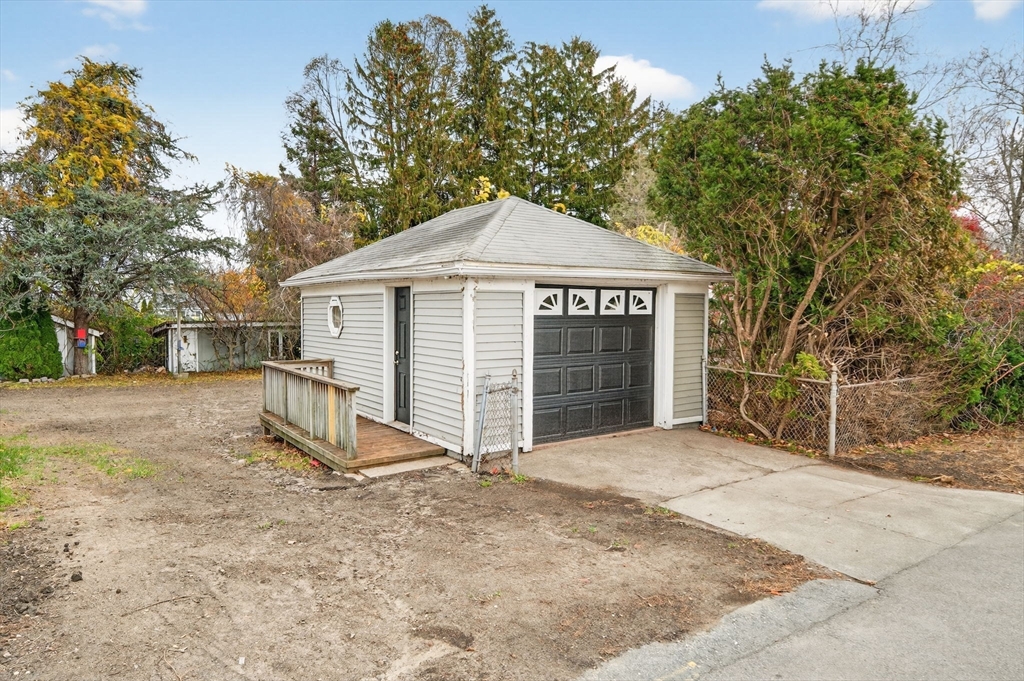 228 Dickinson Street Fall River, MA 02721 - Photo 36 of 40 a view of a house with a yard and large tree