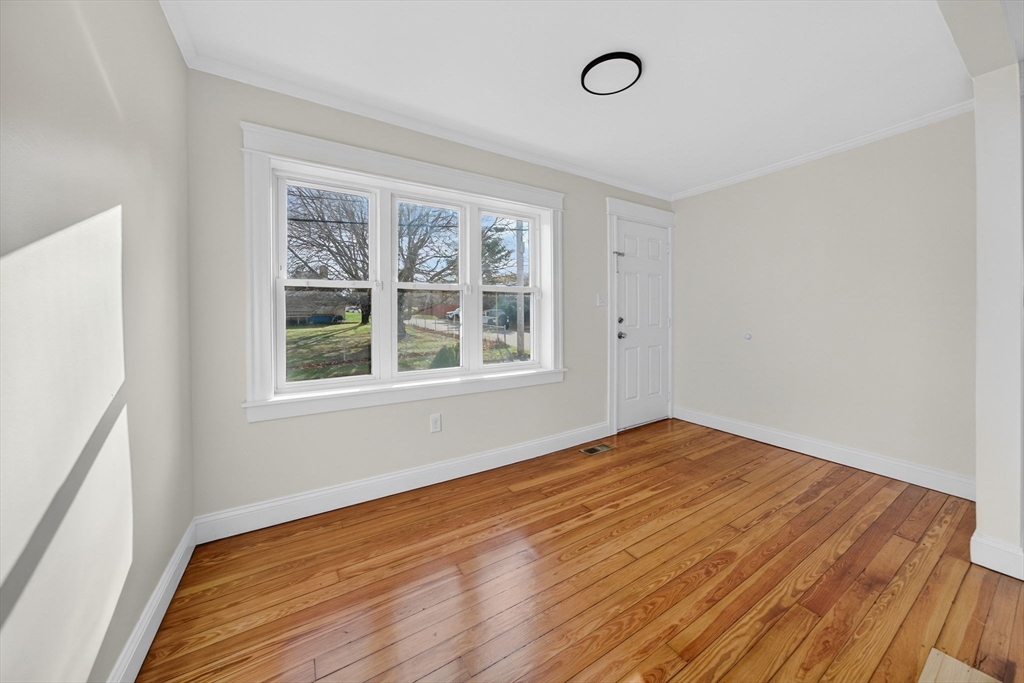 228 Dickinson Street Fall River, MA 02721 - Photo 4 of 40 a view of empty room with wooden floor