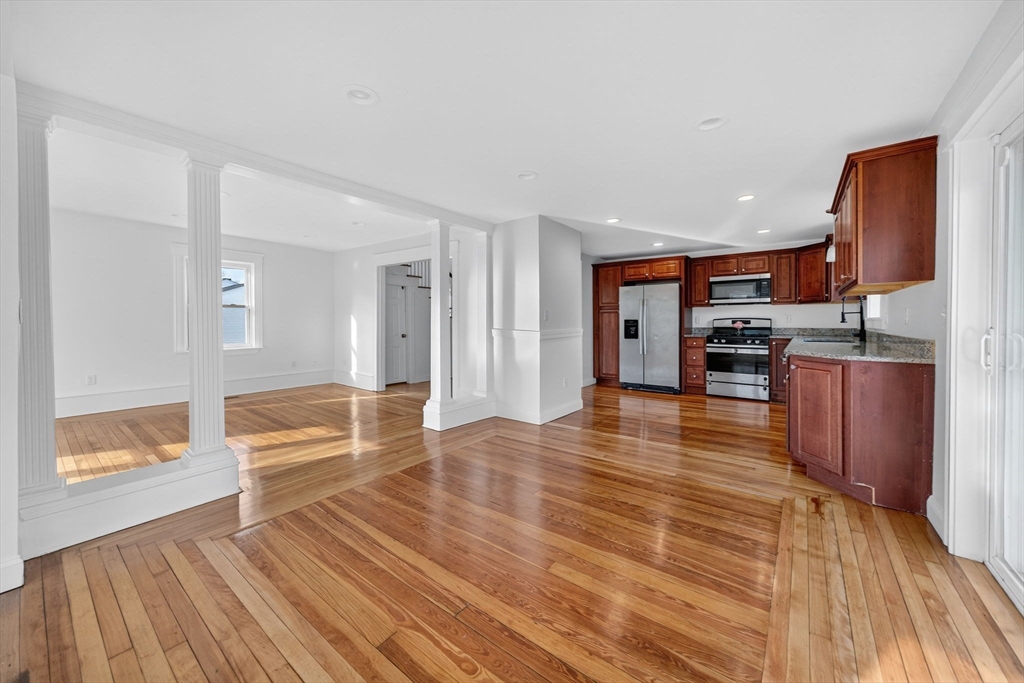 228 Dickinson Street Fall River, MA 02721 - Photo 5 of 40 a view of kitchen with kitchen island wooden cabinets and refrigerator