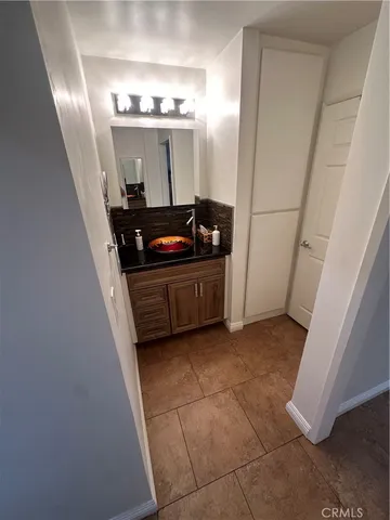 a bedroom with bed and window